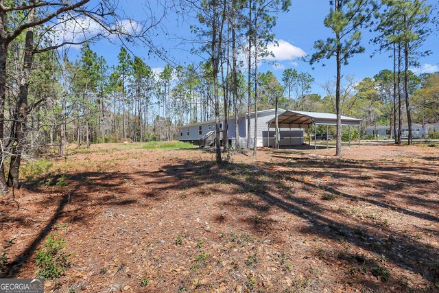 30 David Rd, Hinesville, GA 31313 - view of yard with a detached carport