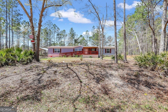 30 David Rd, Hinesville, GA 31313 - rear view of house featuring a deck