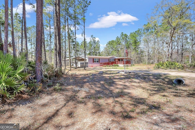 30 David Rd, Hinesville, GA 31313 - view of yard featuring a carport and a wooden deck