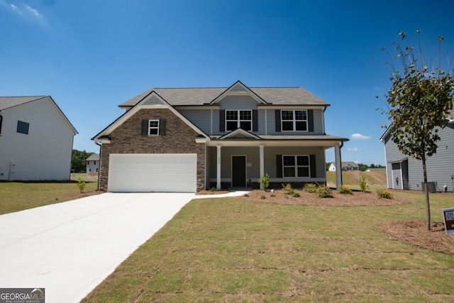 craftsman house with covered porch, a garage, and a front lawn