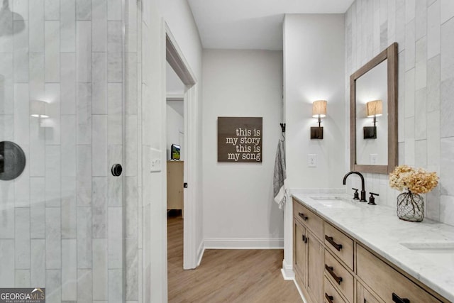 bathroom featuring hardwood / wood-style flooring and vanity