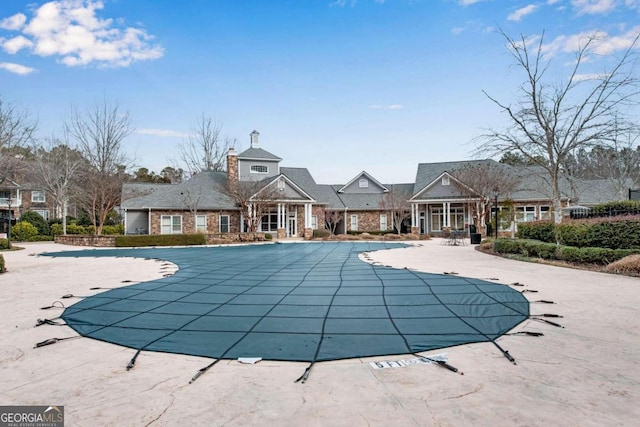 view of swimming pool featuring a patio area