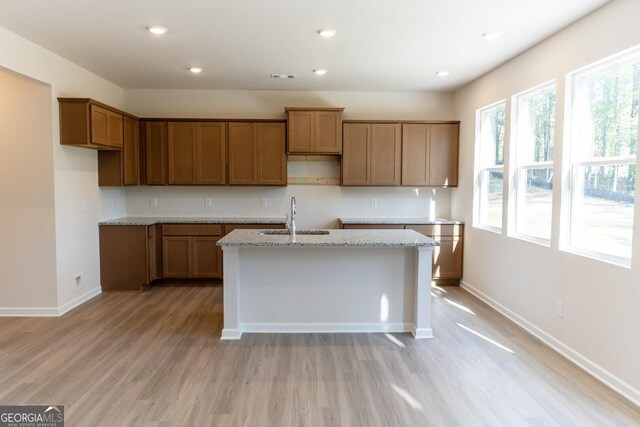 470 River Run Dr Unit 63, Dallas, GA 30132 - kitchen featuring a sink, a center island with sink, plenty of natural light, light wood-style floors, and recessed lighting