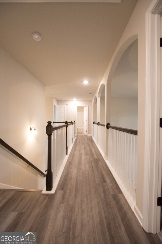 hallway featuring dark hardwood / wood-style flooring