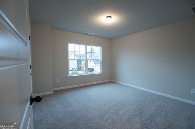 spare room with carpet floors