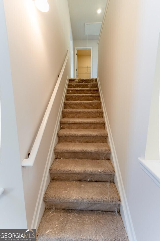 470 River Run Dr Unit 63, Dallas, GA 30132 - staircase featuring attic access and carpet flooring