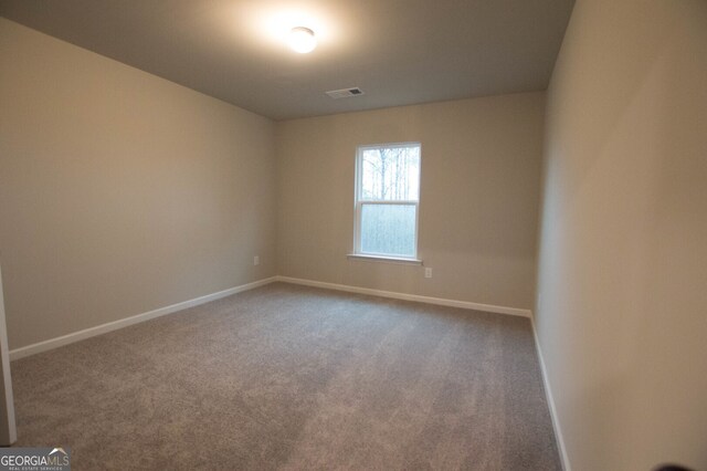 unfurnished room featuring carpet floors