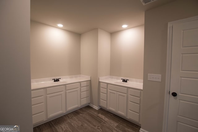 bathroom with vanity and hardwood / wood-style floors