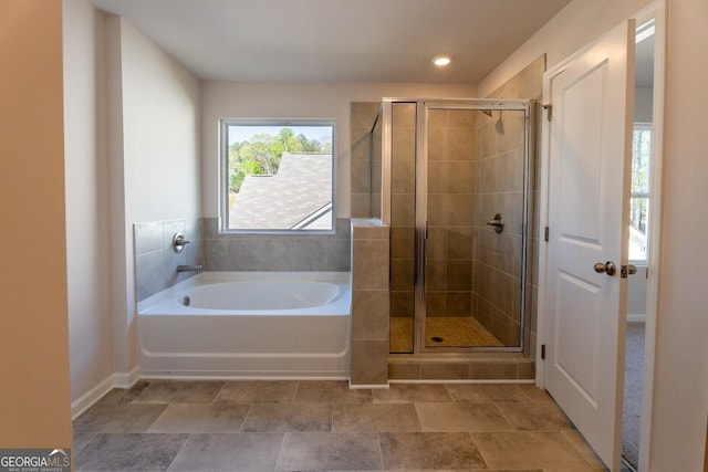 470 River Run Dr Unit 63, Dallas, GA 30132 - bathroom featuring a bath, a shower stall, and baseboards