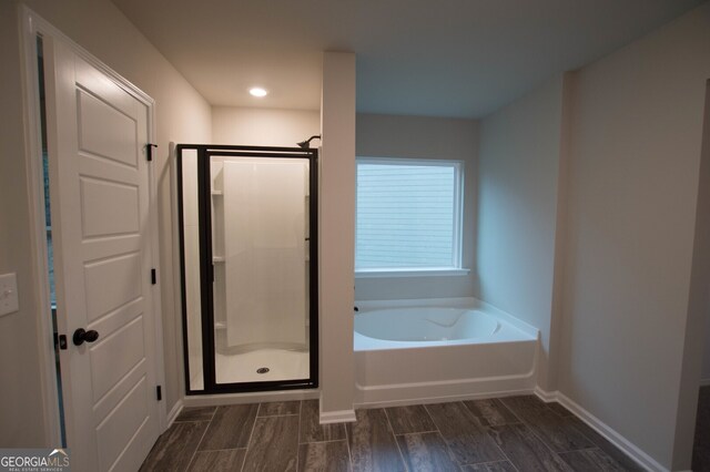 bathroom featuring plus walk in shower