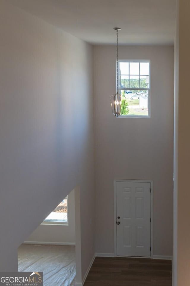 470 River Run Dr Unit 63, Dallas, GA 30132 - entrance foyer featuring a chandelier, healthy amount of natural light, wood finished floors, and baseboards