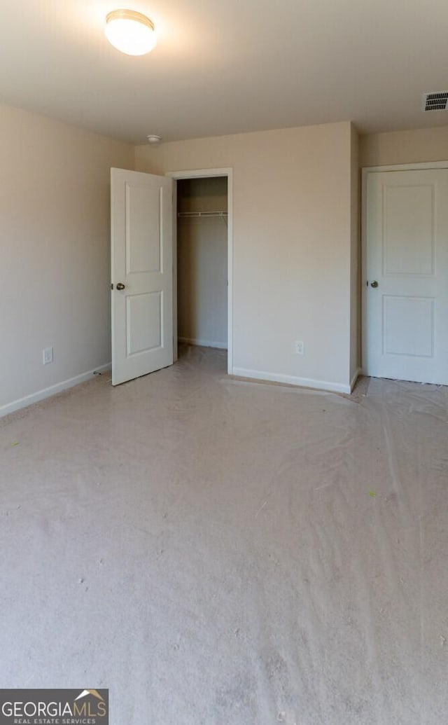 470 River Run Dr Unit 63, Dallas, GA 30132 - unfurnished bedroom with baseboards, light carpet, and a closet