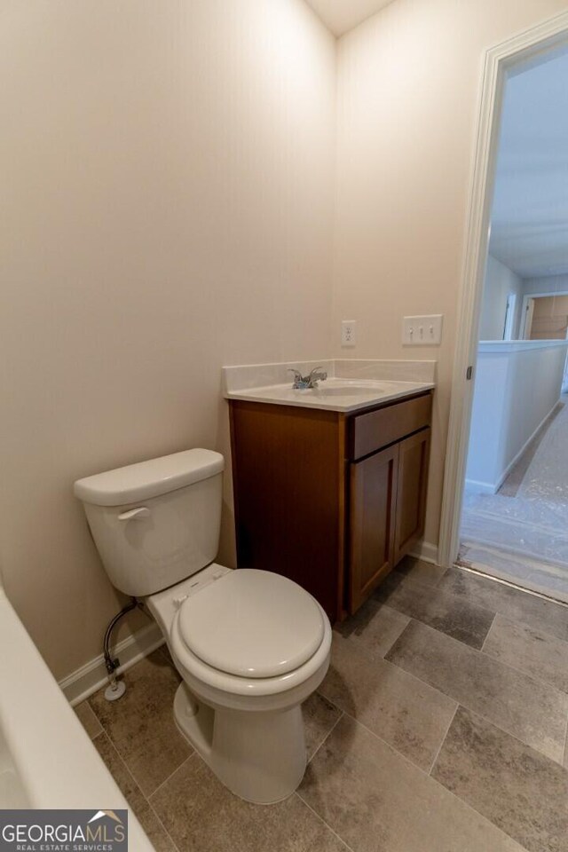 470 River Run Dr Unit 63, Dallas, GA 30132 - half bathroom featuring vanity, toilet, and baseboards