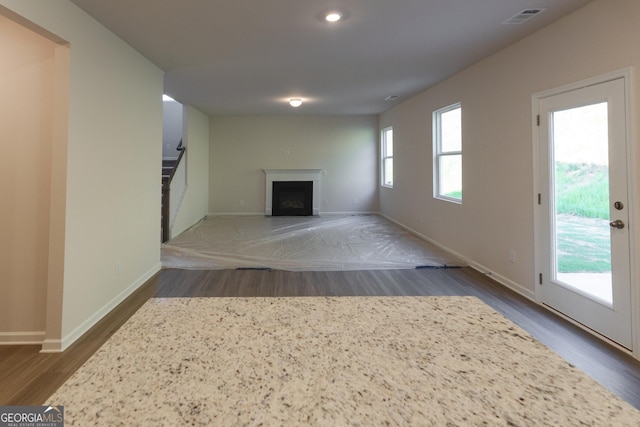 530 River Run Dr Unit 58, Dallas, GA 30132 - unfurnished living room with wood finished floors, stairway, a fireplace, baseboards, and recessed lighting