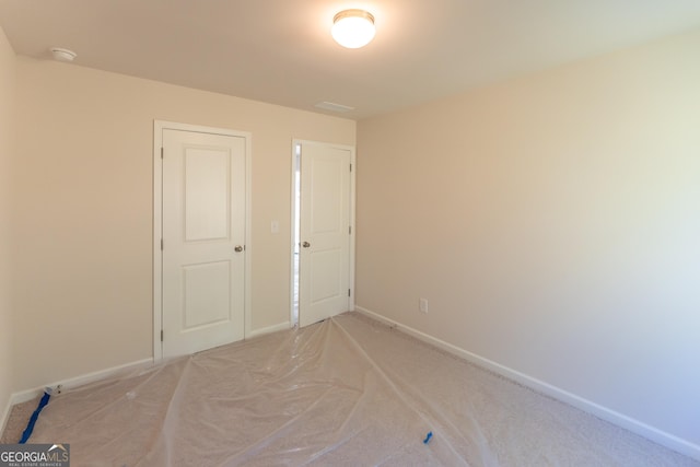 530 River Run Dr Unit 58, Dallas, GA 30132 - spare room featuring light carpet, a smoke detector, and baseboards