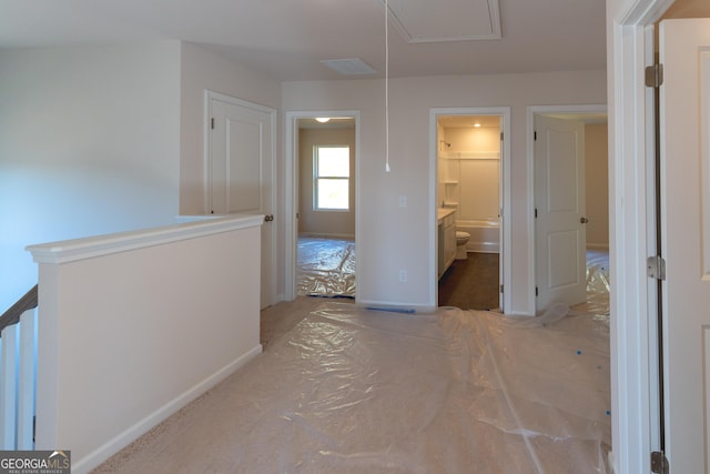 530 River Run Dr Unit 58, Dallas, GA 30132 - corridor featuring baseboards and attic access