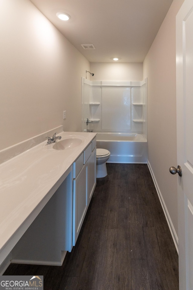 530 River Run Dr Unit 58, Dallas, GA 30132 - bathroom featuring toilet, vanity, wood finished floors, shower / bathtub combination, and recessed lighting