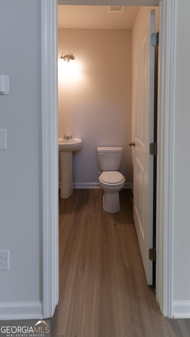 530 River Run Dr Unit 58, Dallas, GA 30132 - half bath with wood finished floors, toilet, baseboards, and a sink