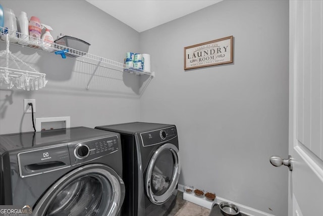 washroom featuring washer and dryer