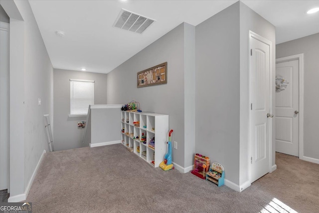 game room featuring light colored carpet