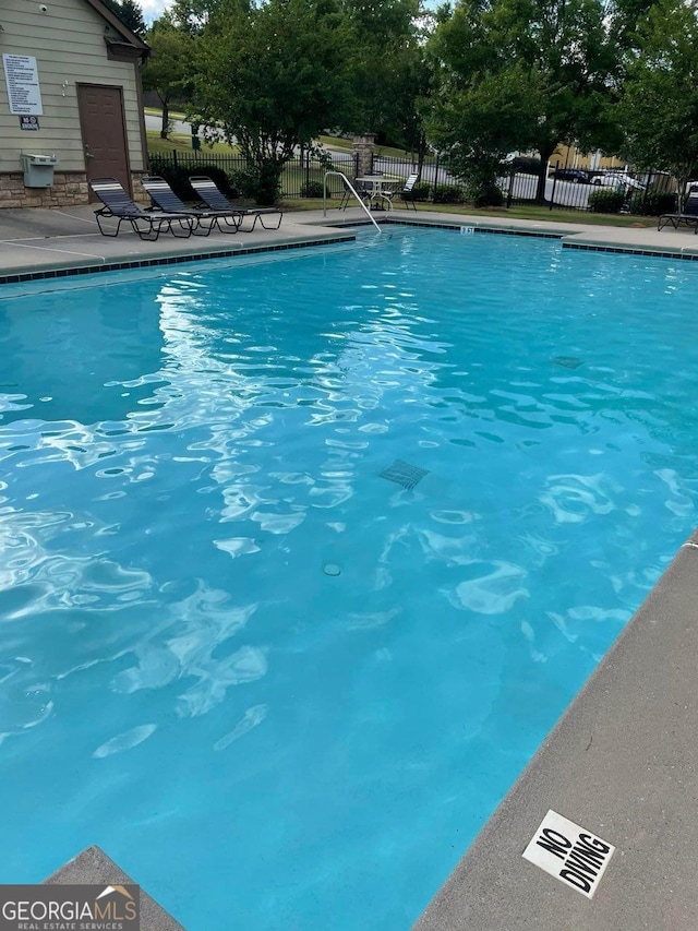 view of swimming pool with a patio