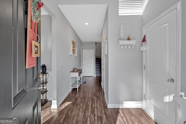 foyer entrance with dark wood-type flooring