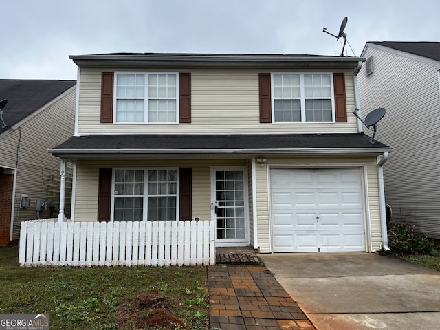 front of property with a garage