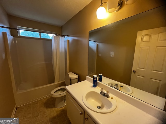 full bathroom featuring toilet, shower / bath combo, vanity, and a textured ceiling