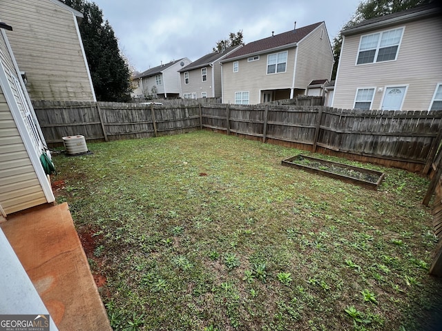 view of yard with central air condition unit