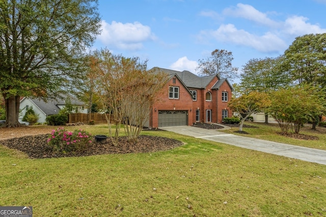 view of property with a front yard and a garage