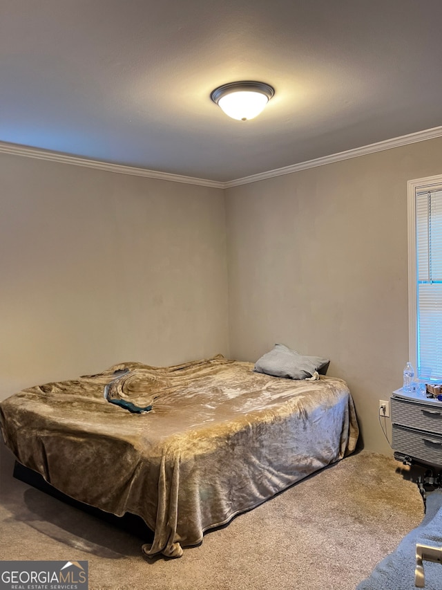 bedroom featuring carpet floors and crown molding