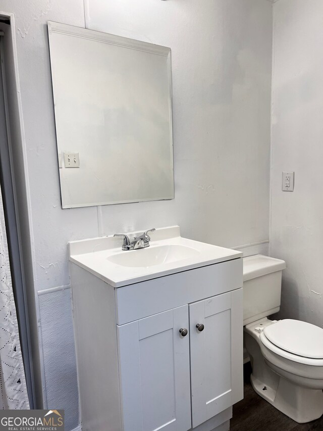 bathroom featuring vanity and hardwood / wood-style flooring