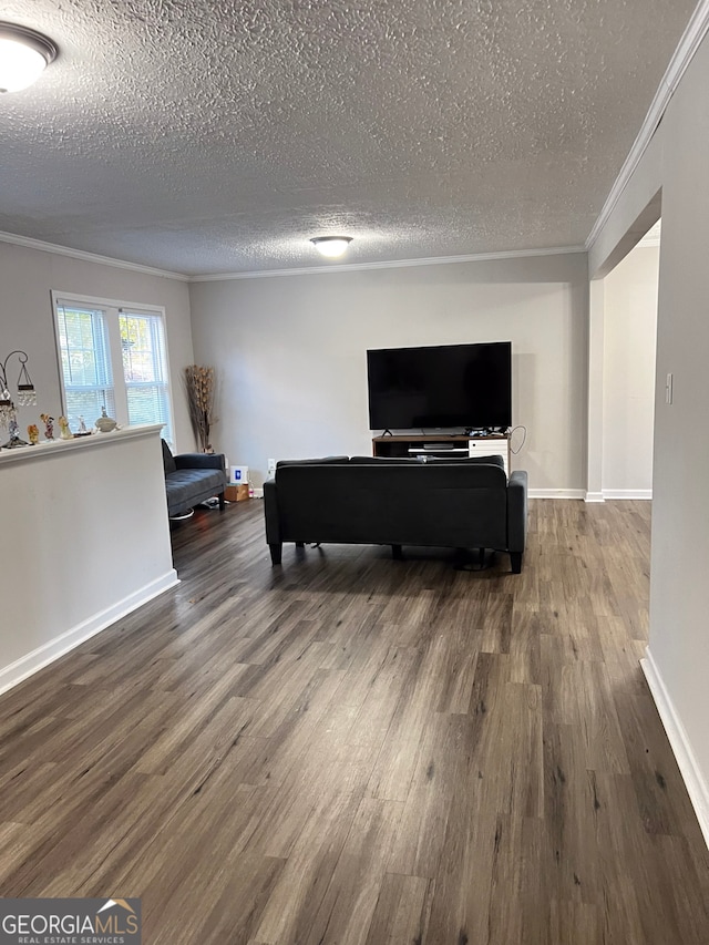 living room featuring ornamental molding, a textured ceiling, and hardwood / wood-style flooring