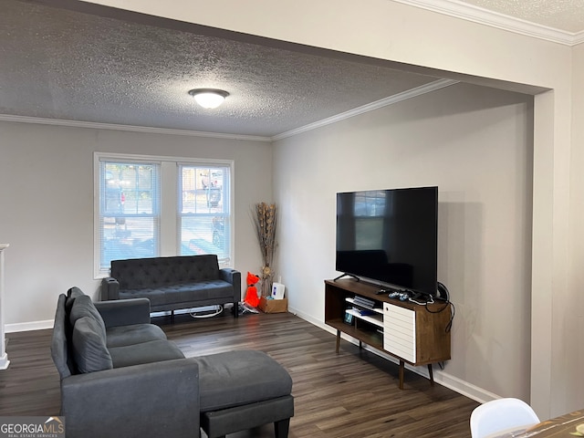 living area featuring dark wood-style floors, ornamental molding, a textured ceiling, and baseboards