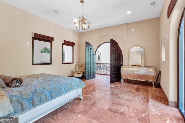 bedroom with a chandelier