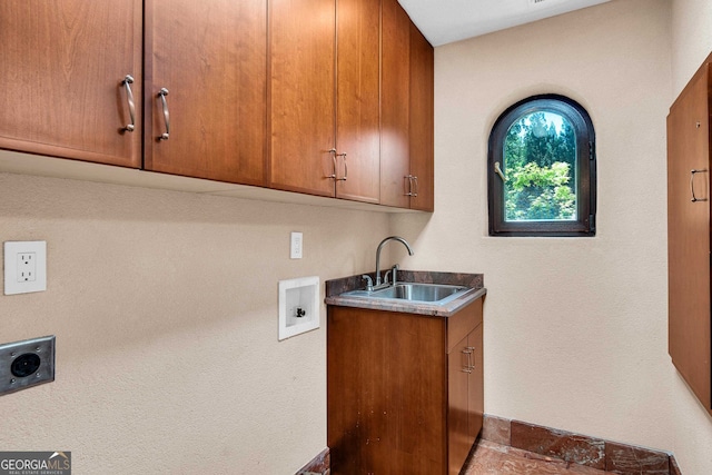 laundry area with washer hookup, electric dryer hookup, cabinets, and sink