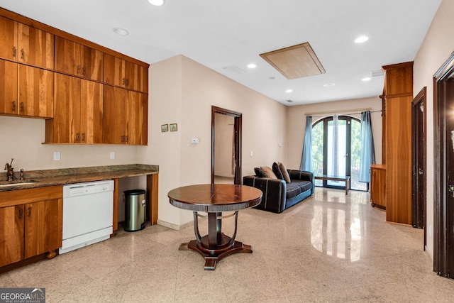 kitchen with white dishwasher and sink