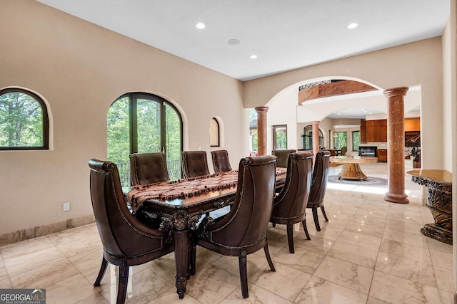 dining room featuring decorative columns