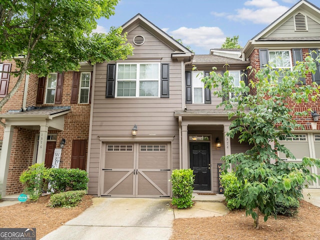 multi unit property featuring a garage