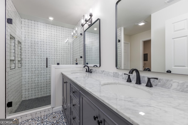 bathroom featuring tile patterned floors, vanity, and an enclosed shower