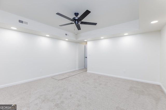 unfurnished room with ceiling fan and carpet flooring