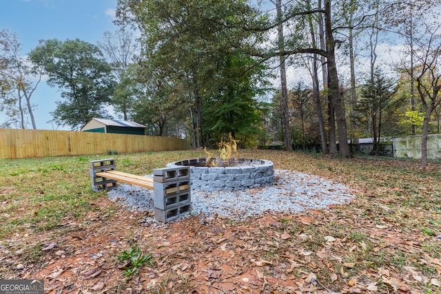 view of yard featuring a fire pit