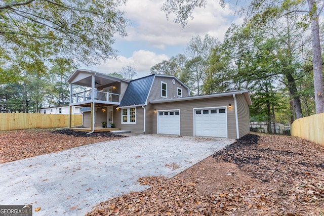 view of front of house featuring a balcony and a garage