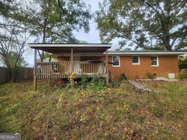 back of property with a deck