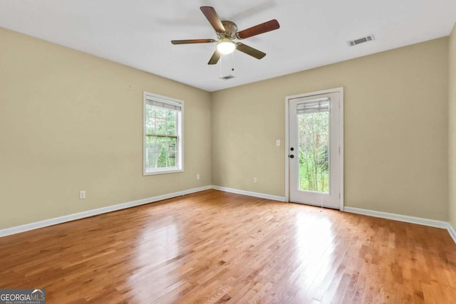 spare room featuring light hardwood / wood-style floors and ceiling fan