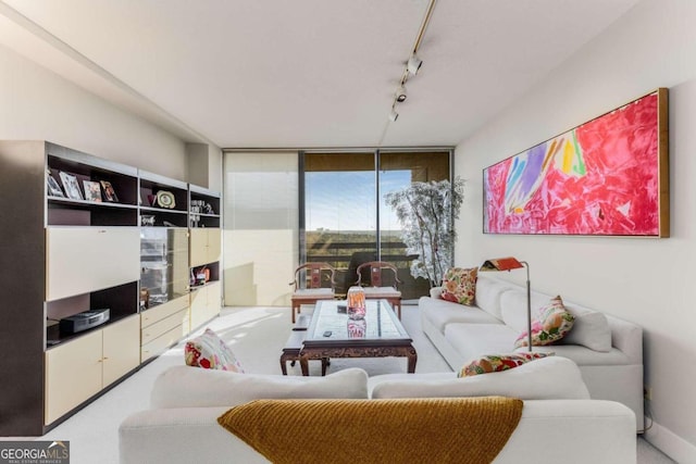 living room with floor to ceiling windows and rail lighting