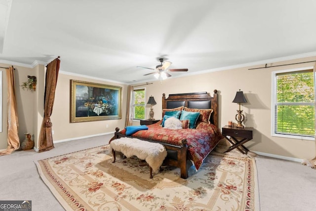 carpeted bedroom with ornamental molding, baseboards, and a ceiling fan