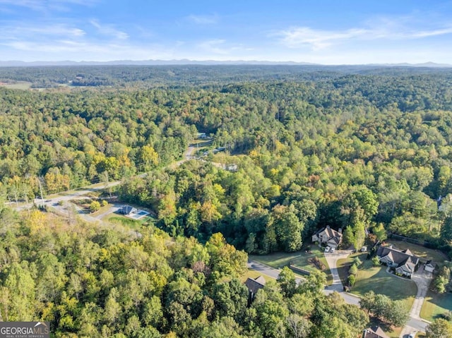 drone / aerial view with a view of trees