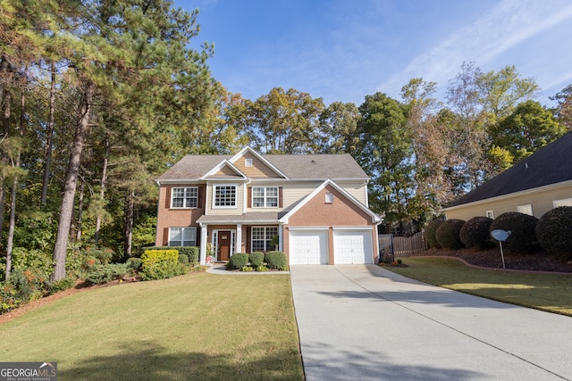 view of front of house featuring a garage and a front lawn