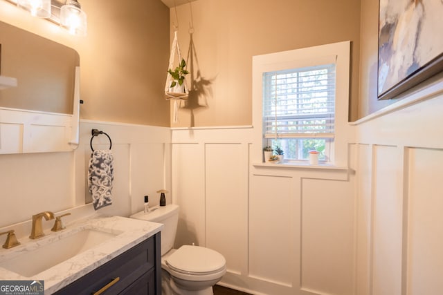 bathroom with vanity and toilet